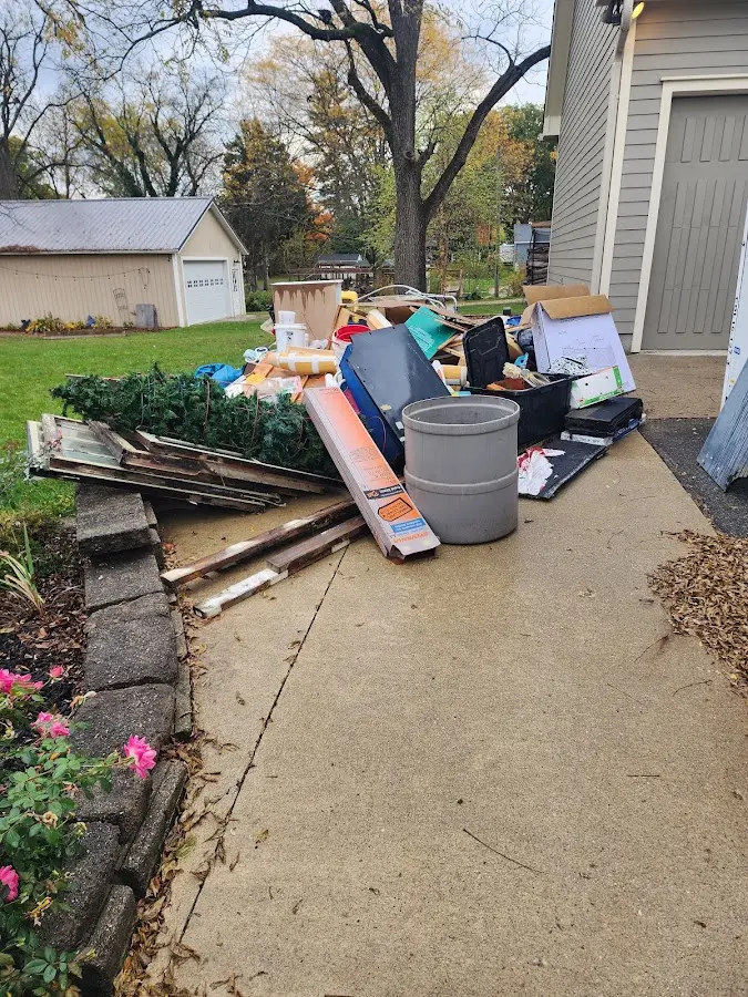 Dumpster being loaded with debris for 12 Yard Dumpster Rental in Haddam